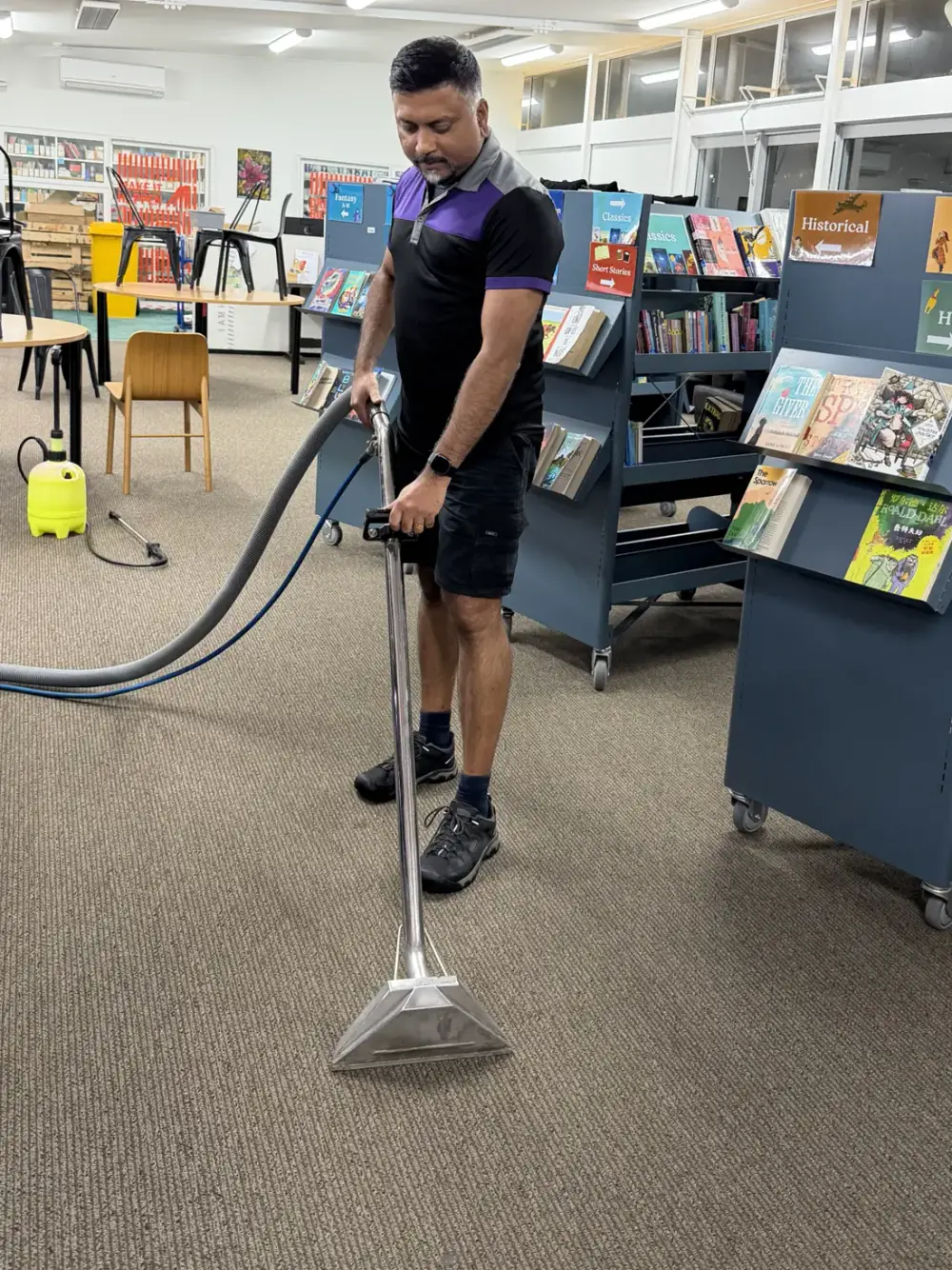 Bency steam-cleaning carpet at an Auckland library, a large commercial job